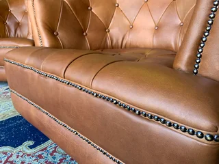 (ON PROMOTION) 2 x immaculate genuine leather DEEP BUTTONED CHESTERFIELD tubchairs R15995 for both.