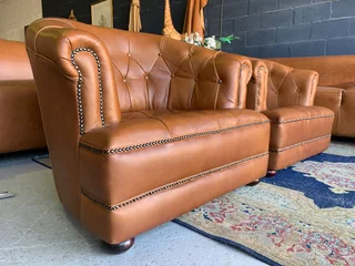 (ON PROMOTION) 2 x immaculate genuine leather DEEP BUTTONED CHESTERFIELD tubchairs R15995 for both.