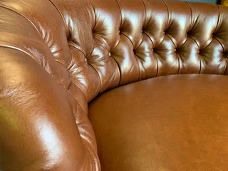 A elegant 1.3m FRENCH STYLE genuine leather deep buttoned two seater lsofa. (A VINTAGE COLLECTION)