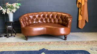 A elegant 1.3m FRENCH STYLE genuine leather deep buttoned two seater lsofa. (A VINTAGE COLLECTION)