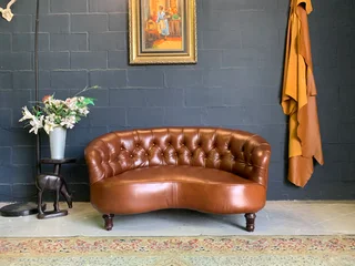 A elegant 1.3m FRENCH STYLE genuine leather deep buttoned two seater lsofa. (A VINTAGE COLLECTION)