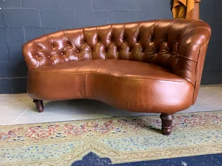 A elegant 1.3m FRENCH STYLE genuine leather deep buttoned two seater lsofa. (A VINTAGE COLLECTION)