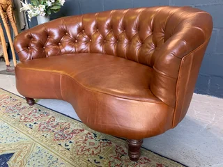 A elegant 1.3m FRENCH STYLE genuine leather deep buttoned two seater lsofa. (A VINTAGE COLLECTION)