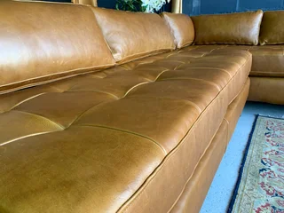 Brand new (2.8m x 2.4m)  genuine leather MODERN &amp; SLEEK DESIGN L-shape corner lounge suite.