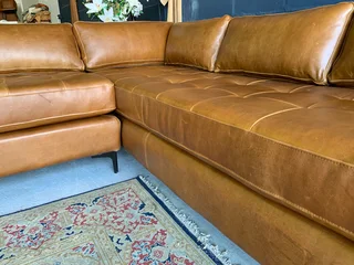 Brand new (2.8m x 2.4m)  genuine leather MODERN &amp; SLEEK DESIGN L-shape corner lounge suite.