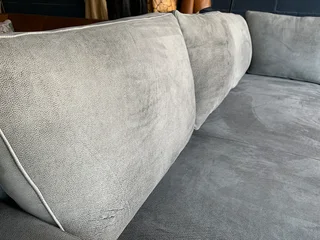 A magnificent (2.4m x 2.4m) ZAMBEZI GRAPHITE GREY genuine leather L-shape corner lounge suite,