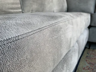 A magnificent (2.4m x 2.4m) ZAMBEZI GRAPHITE GREY genuine leather L-shape corner lounge suite,