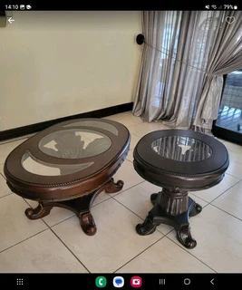 Urgent sale !!!X2 Dark brown wooden tables with intricate detail and glass tops