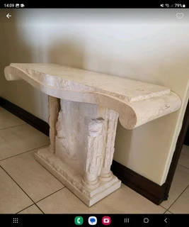 X2 Cream stone carved coffee table with matching vase and side server.  Side server alone was R19000