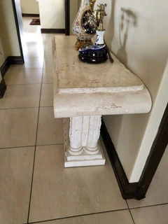 X2 Cream stone carved coffee table with matching vase and side server.  Side server alone was R19000