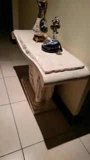 X2 Cream stone carved coffee table with matching vase and side server.  Side server alone was R19000