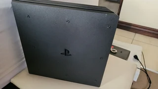 Ps4 pro 1 terabyte includes headphones and x2 controllers and games and also charging station