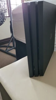 Ps4 pro 1 terabyte includes headphones and x2 controllers and games and also charging station