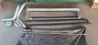 NISSAN NP200 ROLL BARS &amp; BAKKIE COVER WITH  SCREWS (COVERS &amp; RAILS)