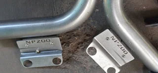 NISSAN NP200 ROLL BARS &amp; BAKKIE COVER WITH  SCREWS (COVERS &amp; RAILS)