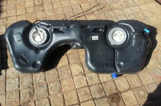 BMW E90 fuel tank complete with fuel pump, door panels and a bucket
