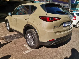 2022 Mazda CX-5 2.0 Active 4x2 AT, Gold with 64000km available now!