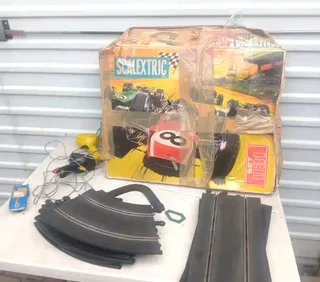 Vintage Scalextric 2 x controls 1x scalextric car needs tlc and 12x tracks.