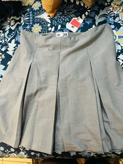 Pleated mini suiting grey . Free delivery in town