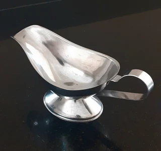 Stainless steel gravy boat.