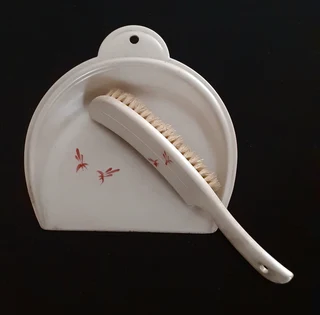 Vintage silent butler bakelite crumb pan and brush.