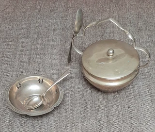 Silver plated bowls with spoons.