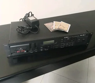 Kawai K4r 16 bit digital synthesizer module with power supply and additional software.