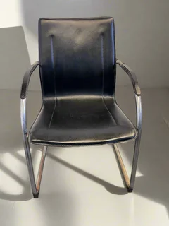 Stylish Black Leather Chair with Chrome Frame – Vintage Appeal Some Rust- A55086