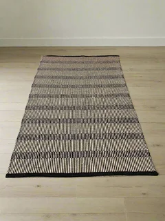 Stylish Black and White Woven Area Rug - Minimalist Design, Slight Wear- A55690