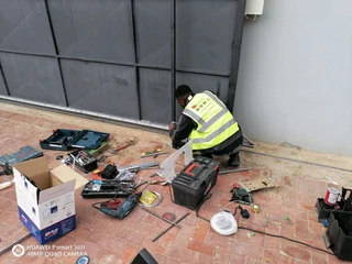 Remote controlled garage doors and gates technicians