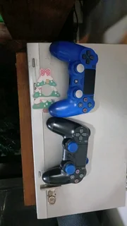 Ps4 1TB console with games and remotes