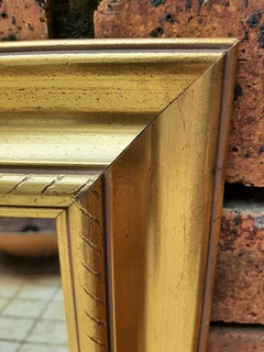 Mirror with gold frame