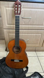 Valencia classical guitar, with a rockstar bag included