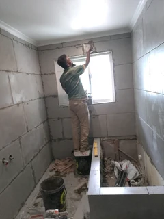 Skilled builder, plaster, skimmer and tiler