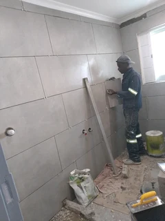 Skilled builder, plaster, skimmer