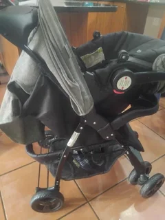 Baby pram with car seat and a material baby harness