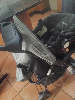 Baby pram with car seat and a material baby harness