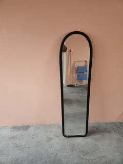 Mirror with cracked plastic frame