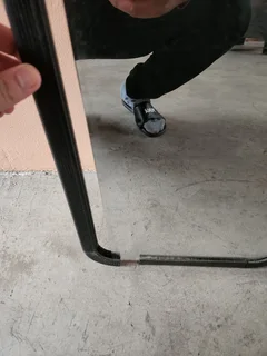 Mirror with cracked plastic frame