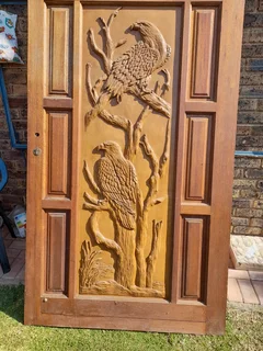 Pivot door with Eagle carvings