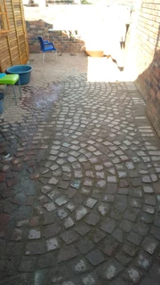 Brick paving and tar surfacing and brick paving