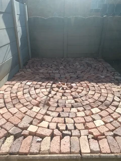 Brick paving and tar surfacing and brick paving