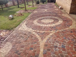Brick paving and tar surfacing and brick paving