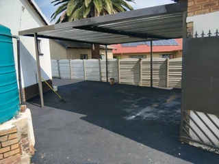 Tar surfacing and brick paving