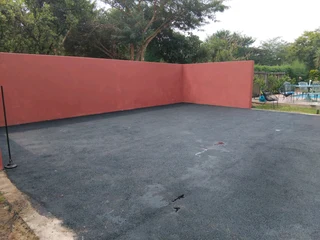 Tar surfacing and brick paving