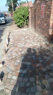 Cobble half brick paving and tar surfacing