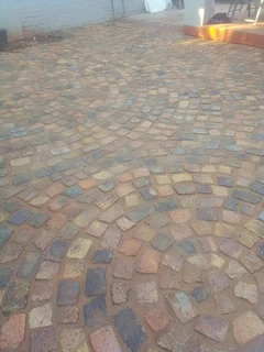 Cobble half brick paving and tar surfacing