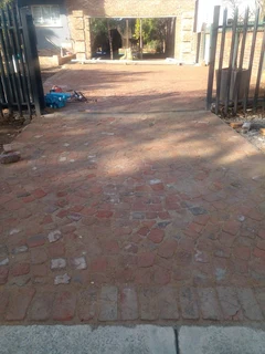 Cobble half brick paving and tar surfacing