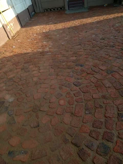 Cobble half brick paving and tar surfacing