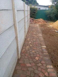 Cobble half brick paving and tar surfacing